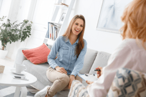 Woman Smiling While Being Counseled