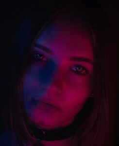 person in purple and pink light Photo by Xyz Shoot on Unsplash