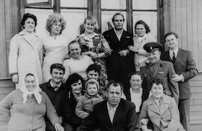 a black and white photo of a family Photo by Chris Curry on Unsplash