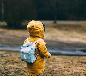 Child in yellow jacket Photo by Daiga Ellaby on Unsplash