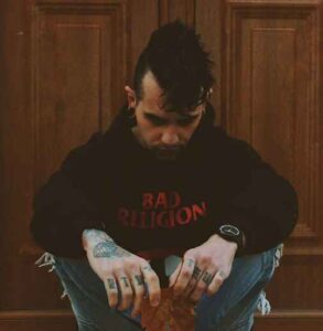 man sitting Photo by Panos Sakalakis on Unsplash