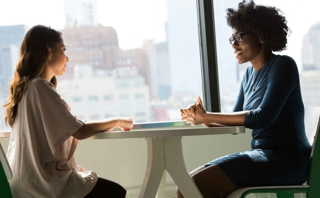 Two women looking at each other