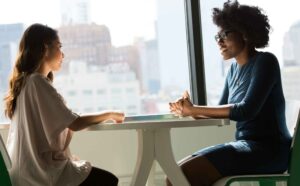 Two women looking at each other